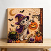 Diamond painting of a purple cat wearing a witch hat and cloak surrounded by Halloween elements like pumpkins and spiderwebs 