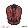Black embroidered patch featuring a stylized angel with outstretched wings and the text St Michael Protectus.