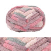A round, hand-knitted wool finger line scarf in shades of pink, purple, and gray.
