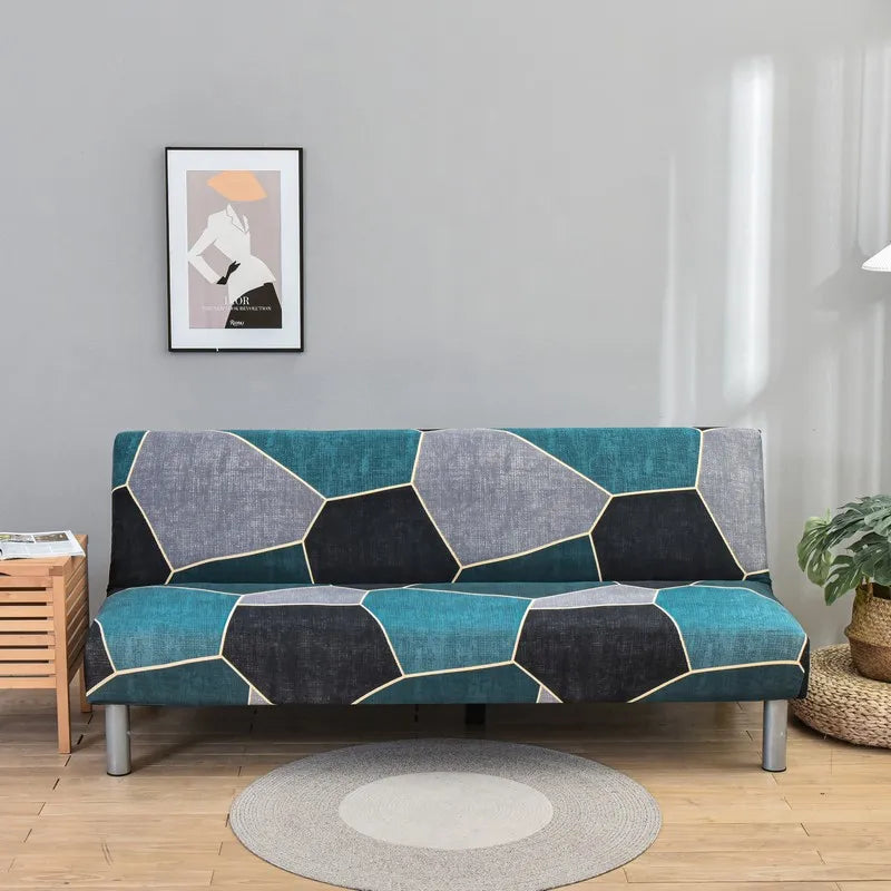 A teal and gray geometric print spandex slipcover on a sofa bed in a modern living room.
