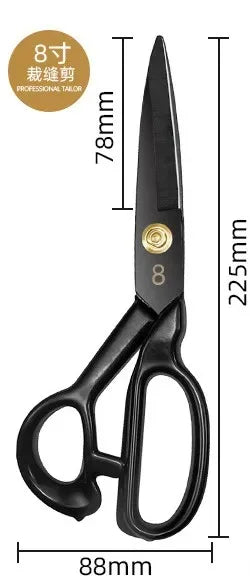 A pair of black professional tailor scissors with gold accents shown against a white background.