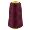 A roll of deep burgundy sewing thread with a yellow core.