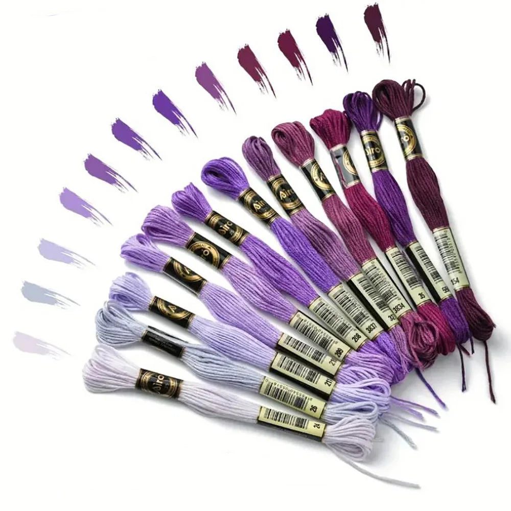 A collection of 12 pack rainbow gradient embroidery floss threads arranged in a fan shape.