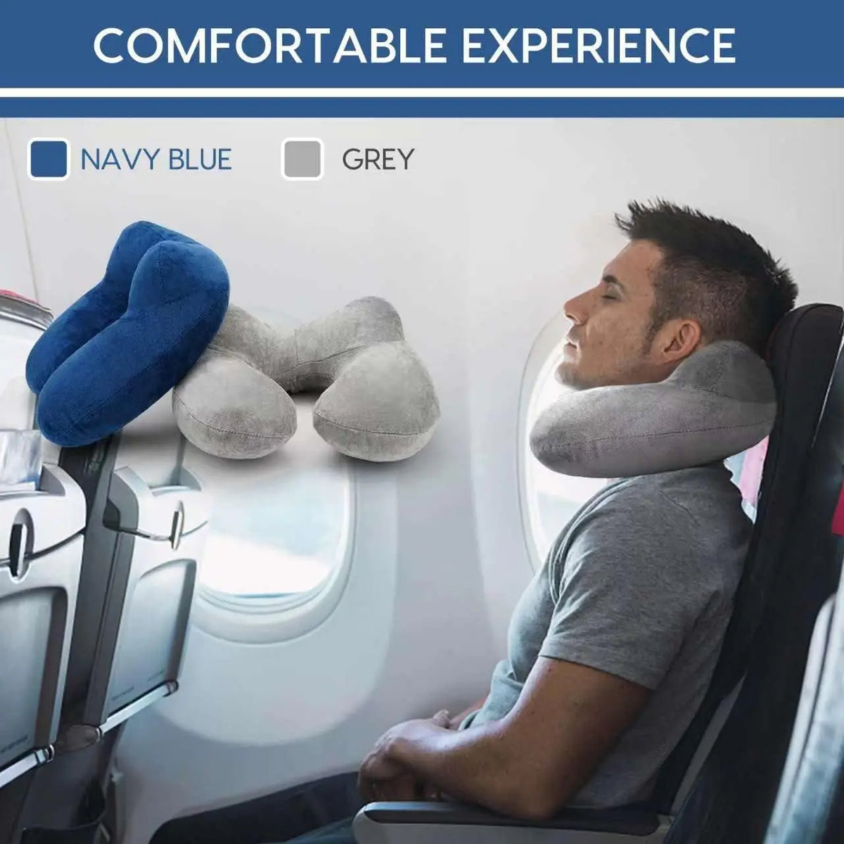 A man rests his head on a grey inflatable travel pillow inside an airplane seat, with navy blue and grey color options visibl