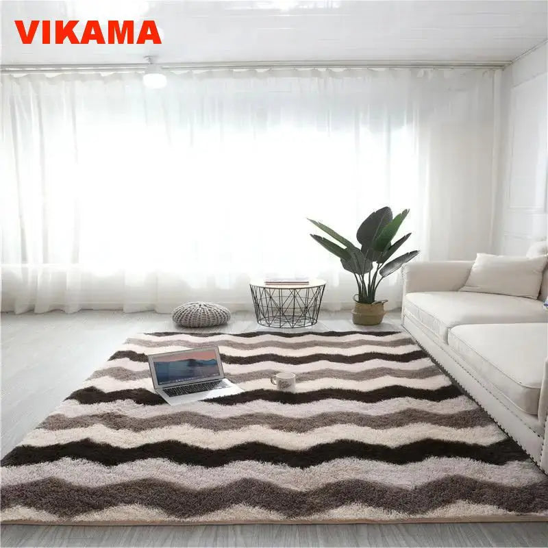 Geometric plush area rug with brown and beige stripes in a bright living room setting.