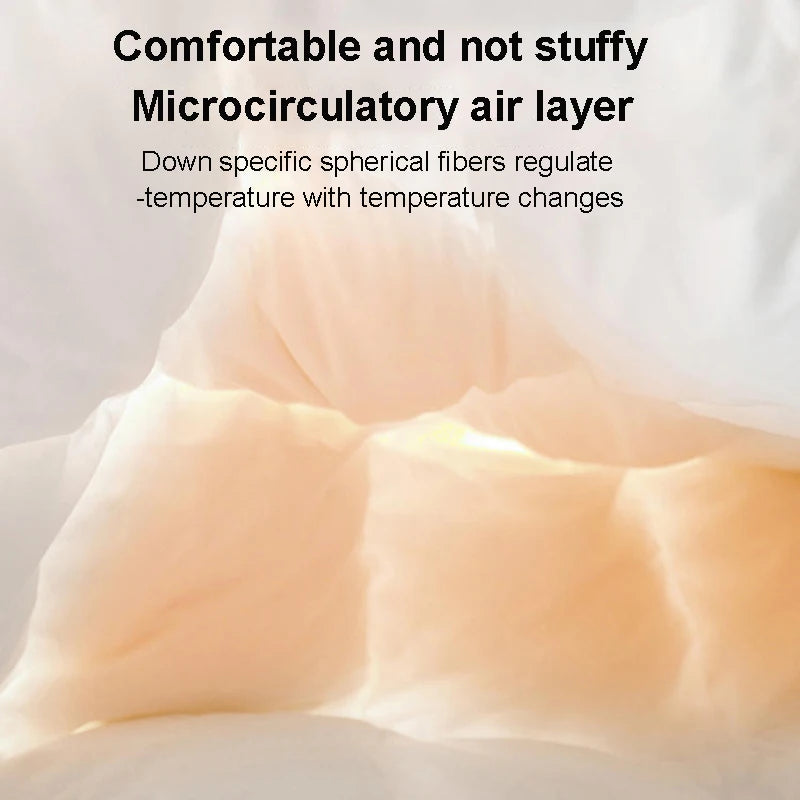 Close-up of a light pink luxury goose down quilt duvet showing its fluffy texture.