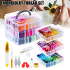 A set of professional embroidery thread and floss kits in clear storage boxes with various colors and tools