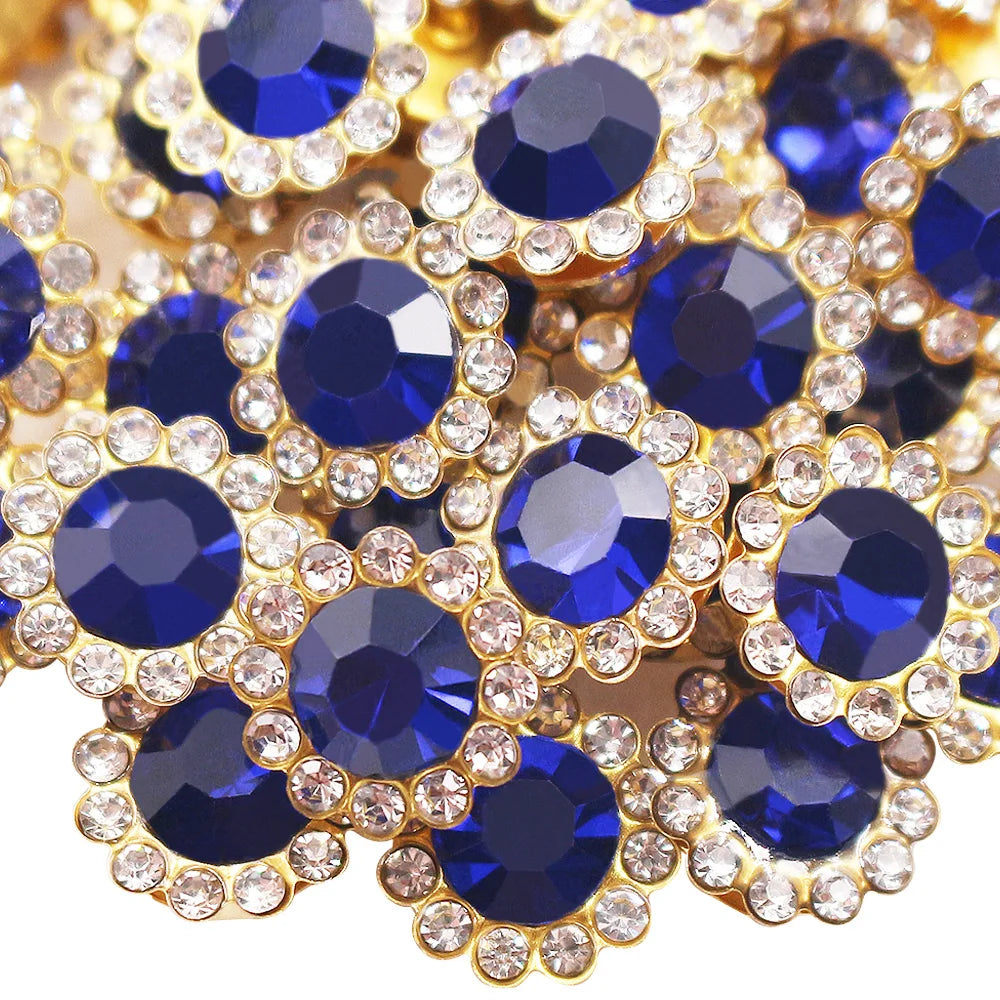 Close-up of gold and blue crystal rhinestone buttons arranged in a floral pattern.