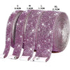 A set of self-adhesive crystal rhinestone ribbon in various sizes S to XL, featuring a purple glitter pattern.