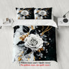 A set of two floral pillowcases and one quilt cover featuring white roses and gold accents on a black background.