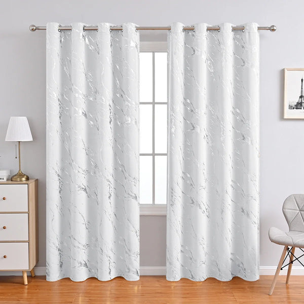 White marble printed curtain panels hanging in a window frame