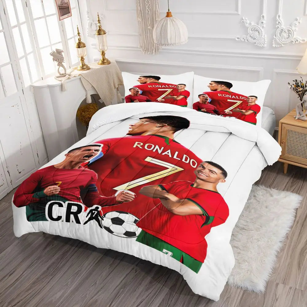 A red soccer themed comforter set featuring multiple players and a soccer ball print.