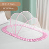 Pink foldable mosquito net for infant cribs with a decorative ruffled edge shown on a bed.