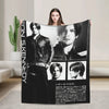 A black and white graphic throw blanket featuring a portrait of a man.
