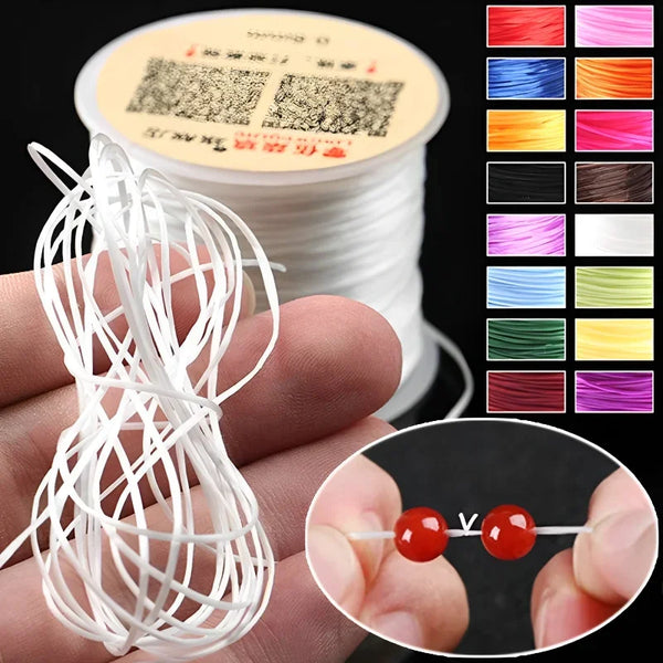 A hand holds a spool of multicolor elastic beading cord and a loose coil of white cord, showing various colors.
