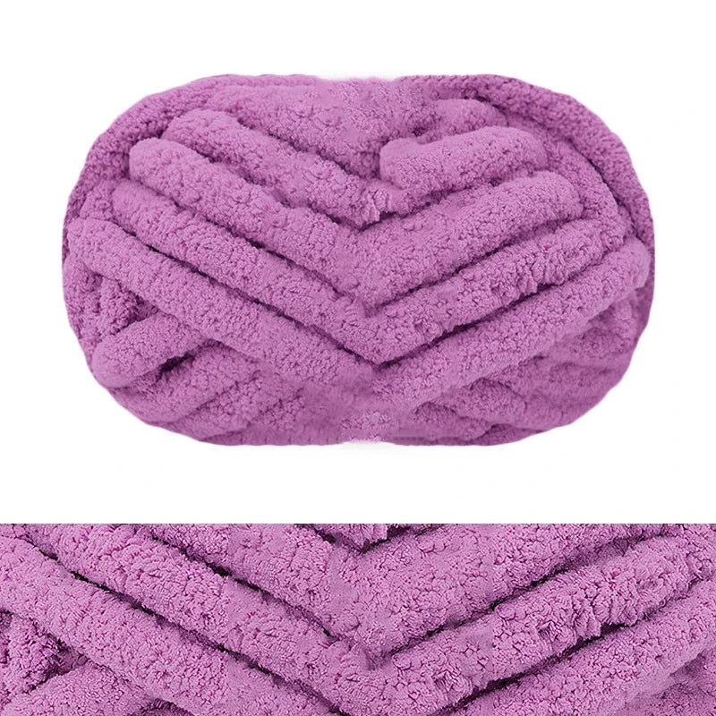 A close-up of a hand-knitted wool finger line scarf in a lavender color with a textured, chevron pattern.