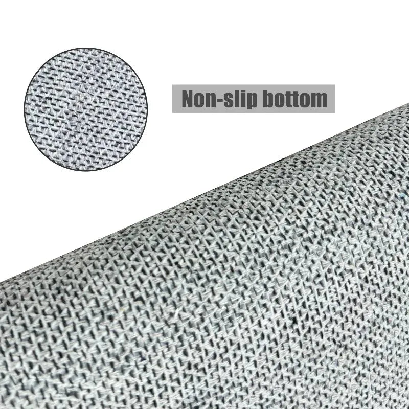 Close-up view of a gray decorative pentagram rug with a non-slip bottom.