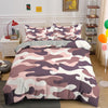A duvet cover set featuring a pink, purple, and white camouflage pattern on a bed.