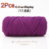A purple reusable elastic yarn skein displayed against a white background.