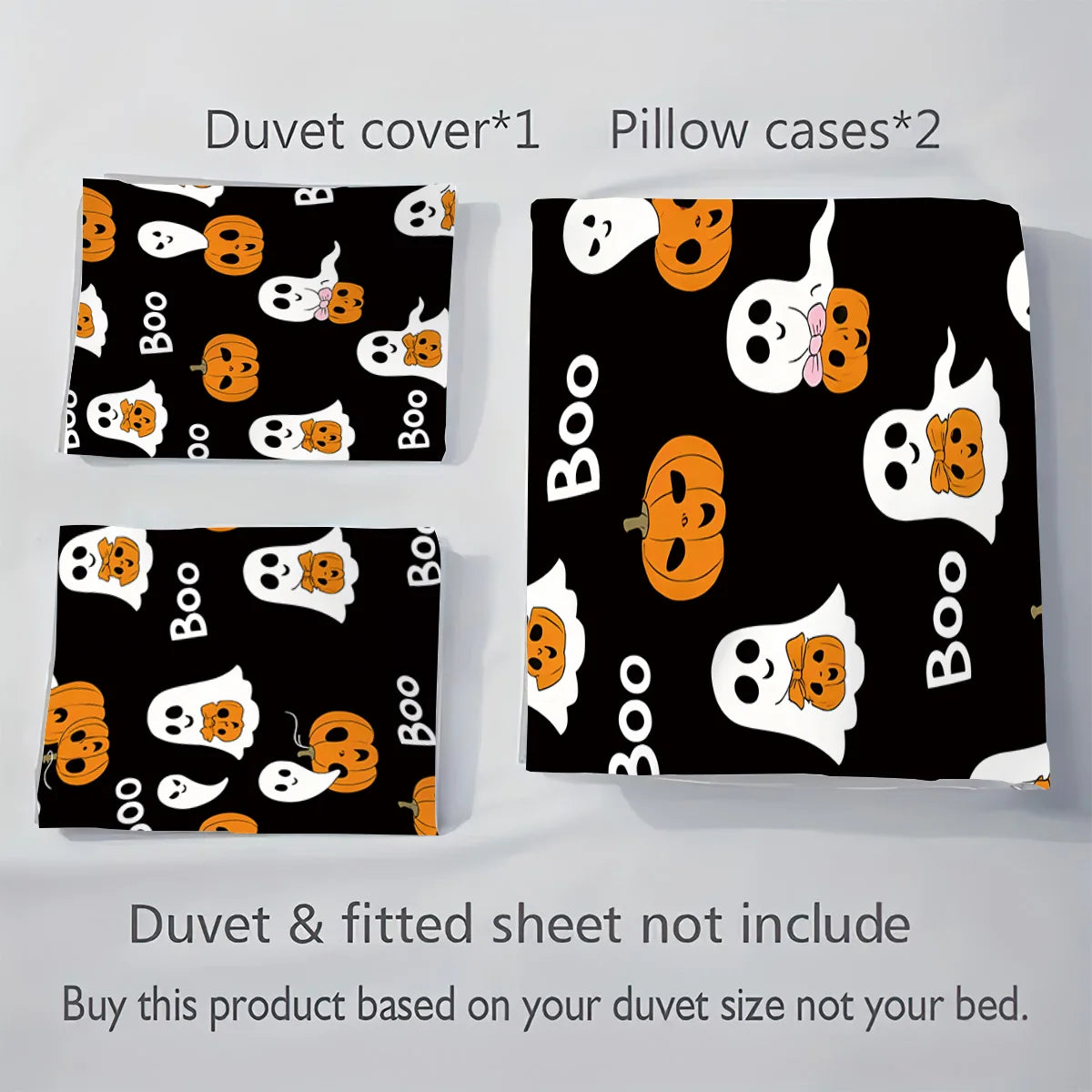 A set of black duvet covers and pillow cases featuring a white ghost pattern with orange accents.