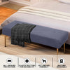 A gray stretch jacquard dining bench cover placed on a bed, showing all-around protection, elastic fit, pet friendly features