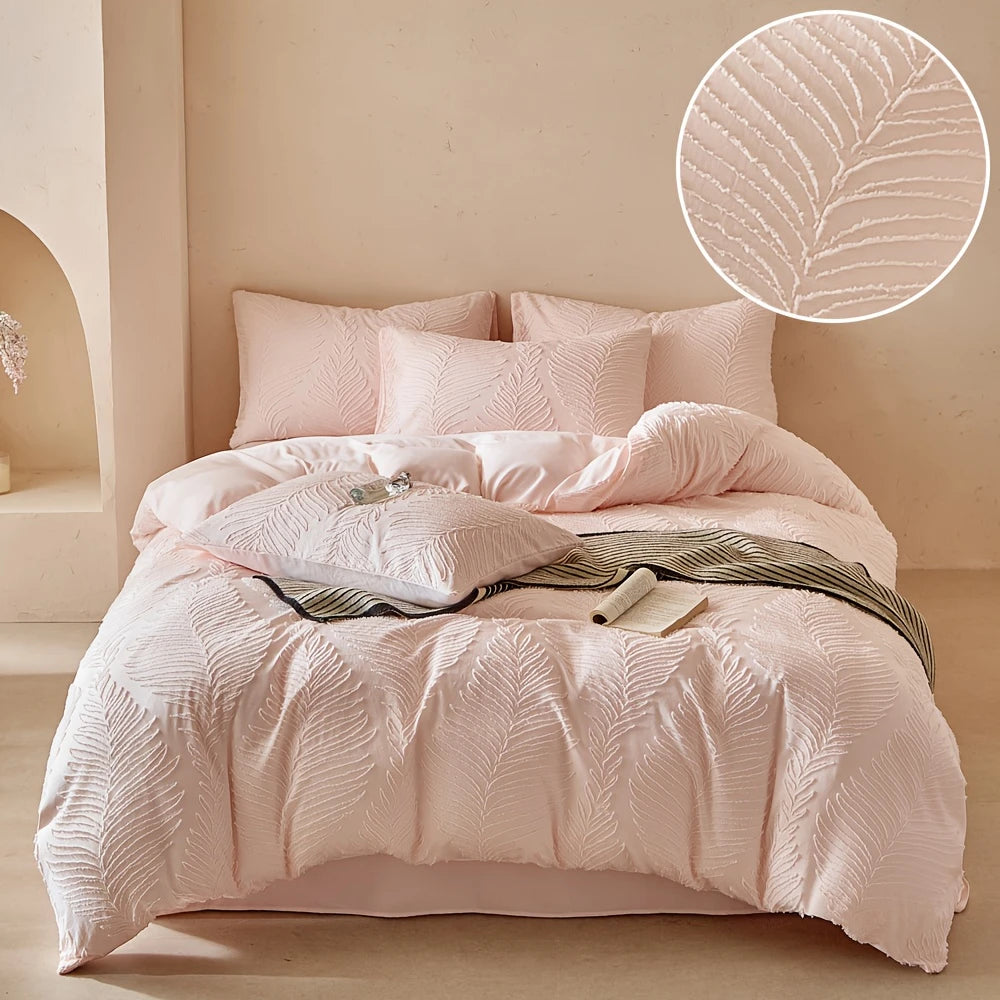 A pink embossed leaf duvet cover set displayed on a bed with a light beige background.