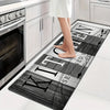 A black and white kitchen mat with text featuring the words seasoned and kitchen