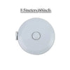 A round white measurement tape with a retractable mechanism, labeled 1.5 meters or 60 inches.