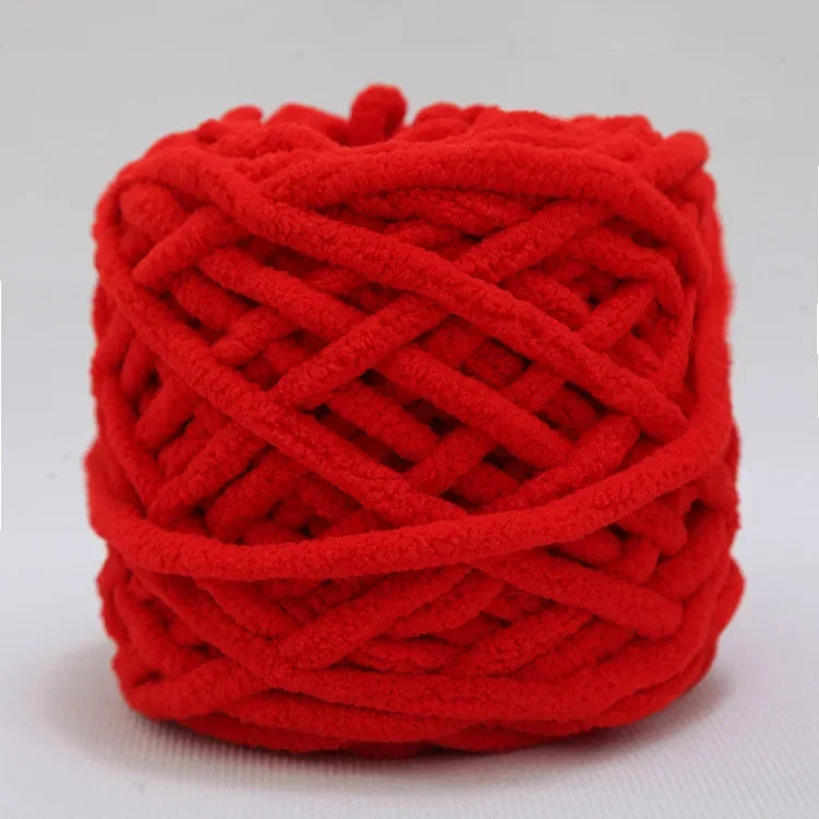 A ball of bright red chenille knitting yarn with a textured, braided appearance.