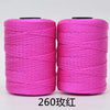 Two spools of bright pink hand knitting and crochet cord for crafting