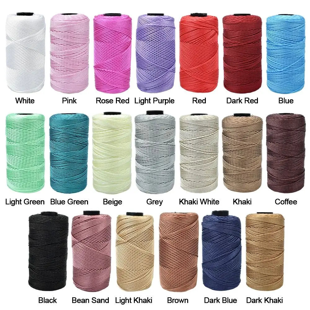 A collection of various colored threads including white, pink, red, blue, and various shades of green, beige, and brown for k