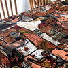 Close-up of a table covered with bohemian printed linen fabric featuring earthy tones and abstract patterns.