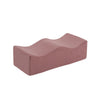 A rectangular, mauve memory foam leg support pillow.