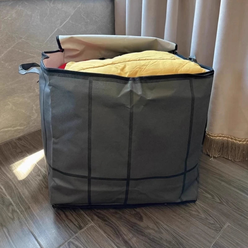 A large gray fabric storage bag with a zipper is open, revealing yellow padding inside.