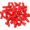 A pile of bright red satin ribbon bows for craft and decoration.