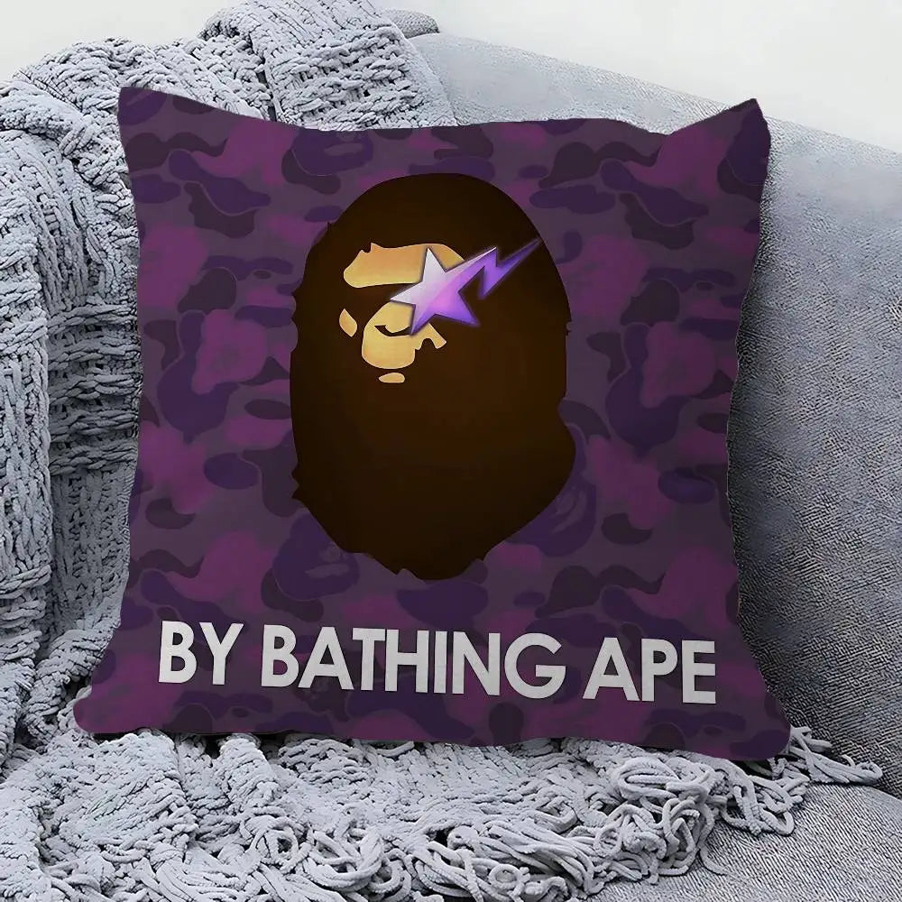 A purple camouflage pillow cover featuring a stylized golden face with a purple lightning bolt and the text BY BATHING APE