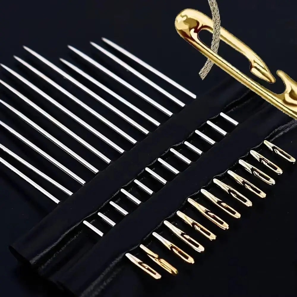 A set of 12 stainless steel self-threading sewing needles with a gold-colored clip displayed on a black background.