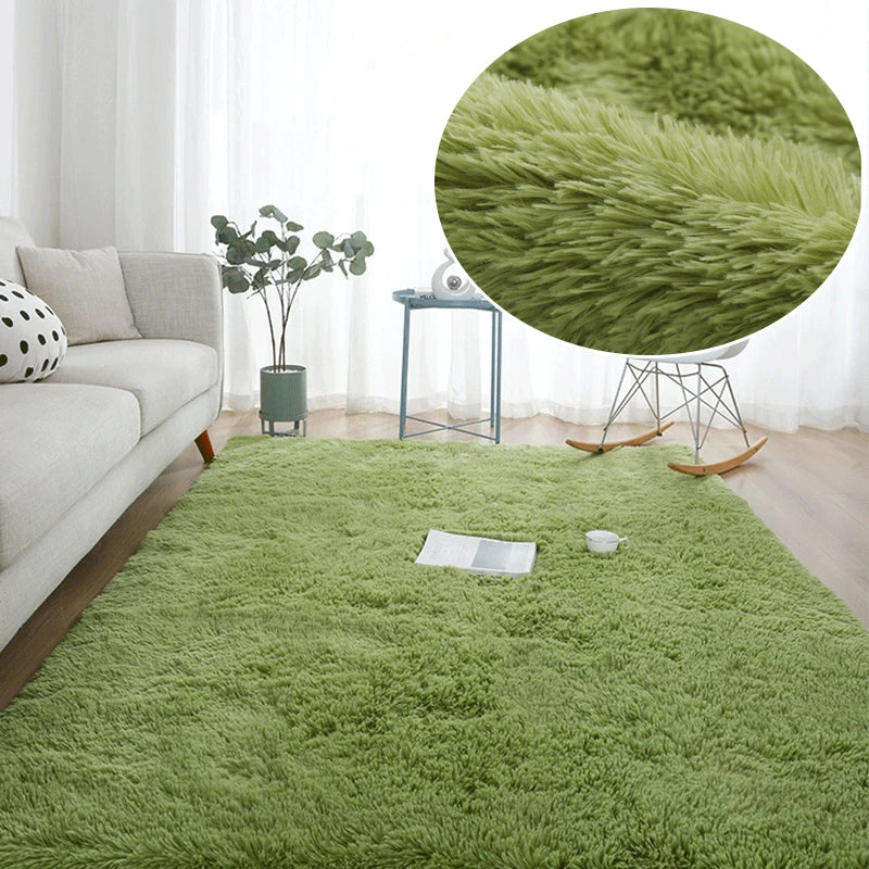 A bright green plush area rug in a bedroom setting with a plant and a small table.