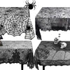 Black spider web lace table runner displayed on a table with a spider above it.