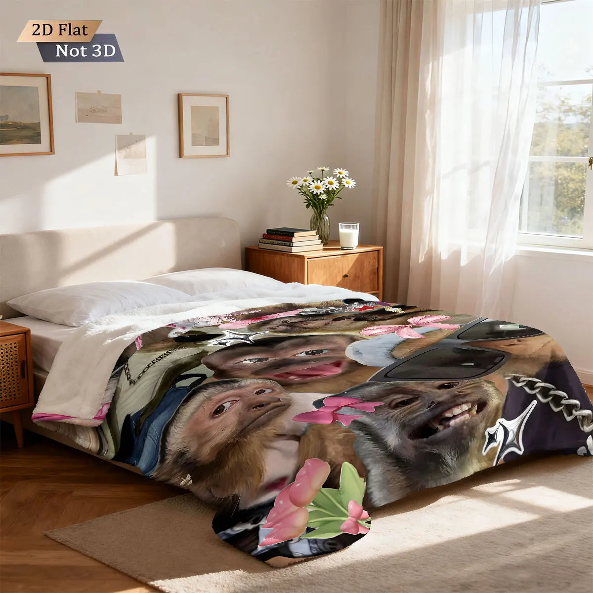 A funny monkey print flannel blanket spread out on a bed with natural light.