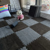 A brown and gray checkered play mat with a pink plush toy and a black roller rolled on it.