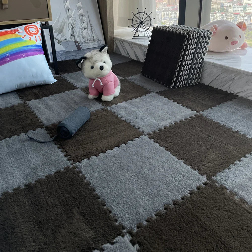 A brown and gray checkered play mat with a pink plush toy and a black roller rolled on it.