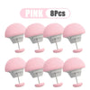 Eight pink adjustable quilt and fabric clips shown in various configurations.