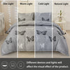 A set of butterfly print duvet covers shown in four light settings: dim, warm, cold, and natural light.
