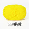 A ball of bright yellow organic cotton 4ply knitting yarn for crafts.