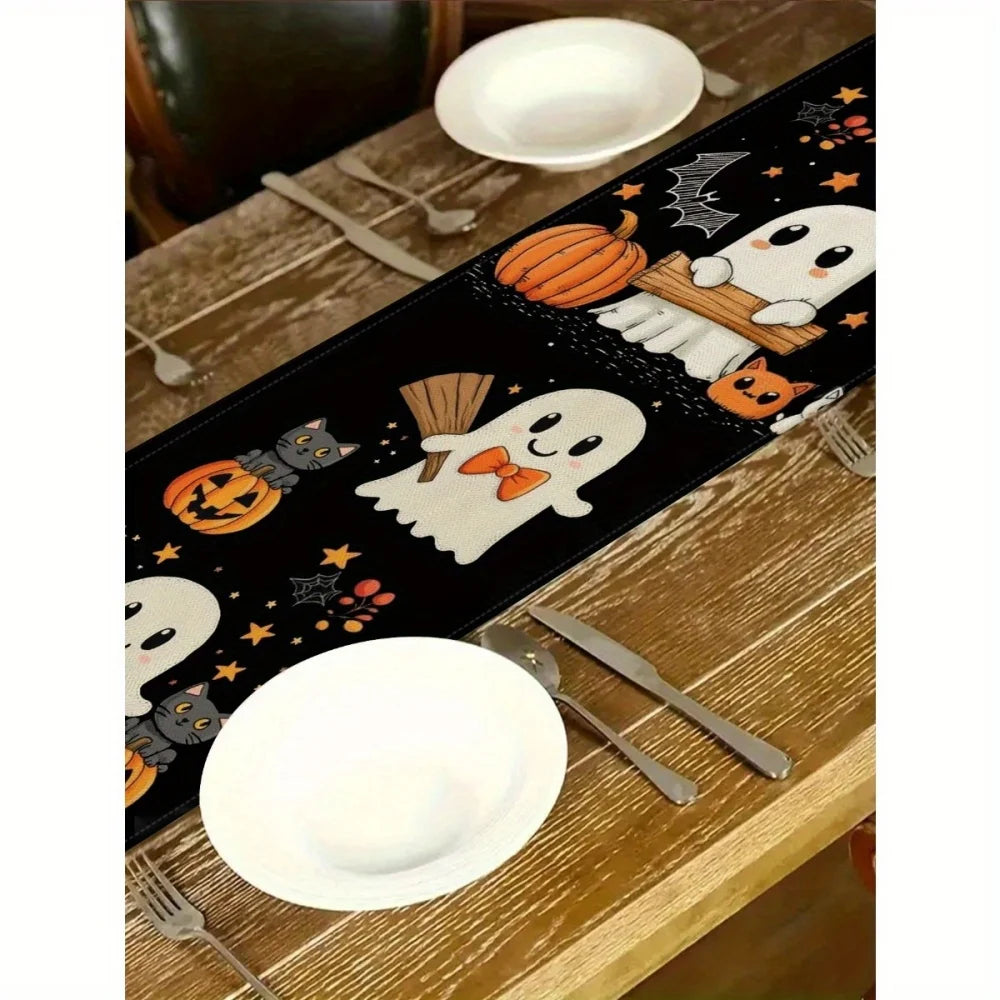 Halloween table runner featuring a black background with orange pumpkin and white spider designs on a wooden table.