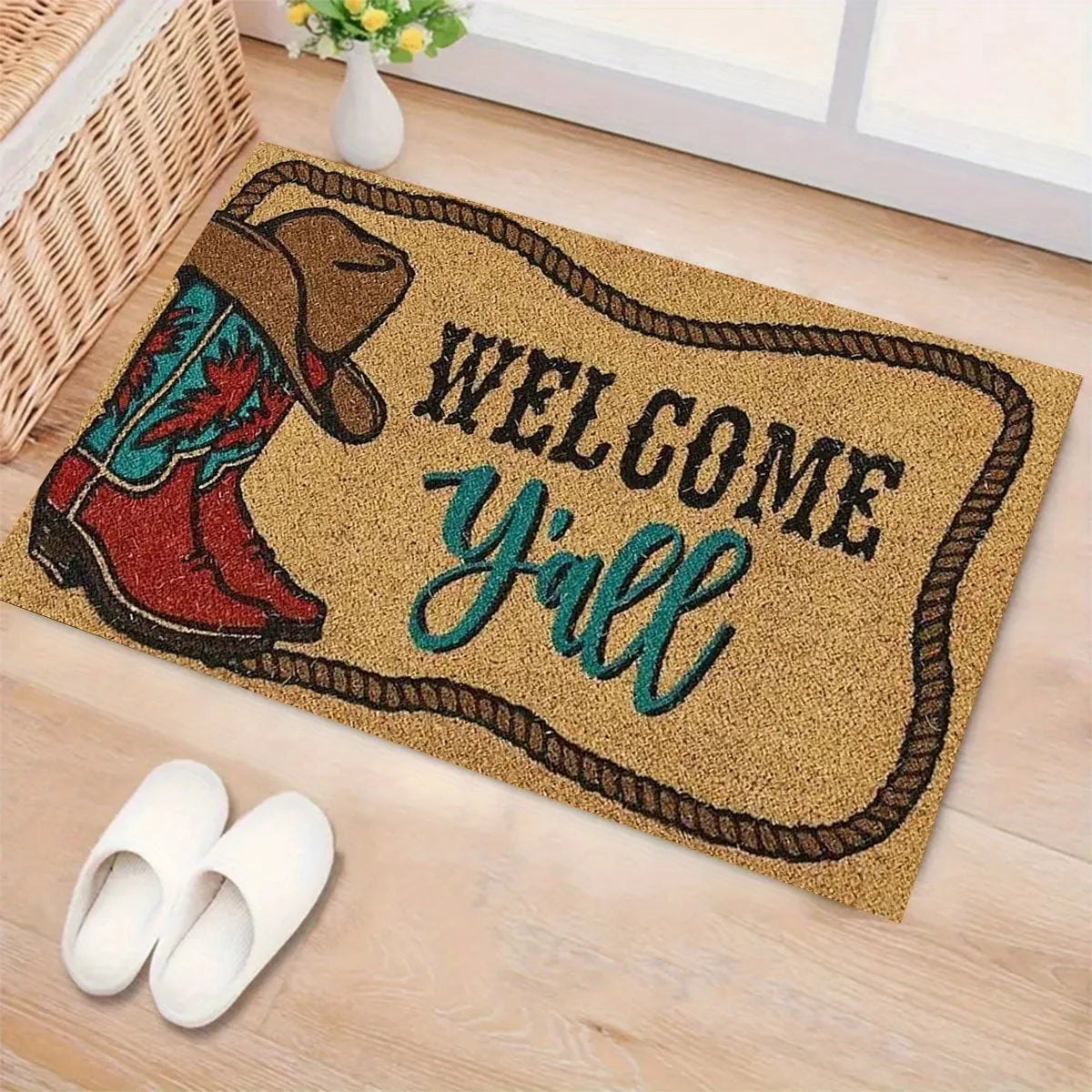 A welcome doormat featuring a cowboy boot design and the text Welcome Y'all on a light wood floor.
