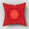 A square decorative cushion cover in a rich, textured red with an intricate Persian pattern.