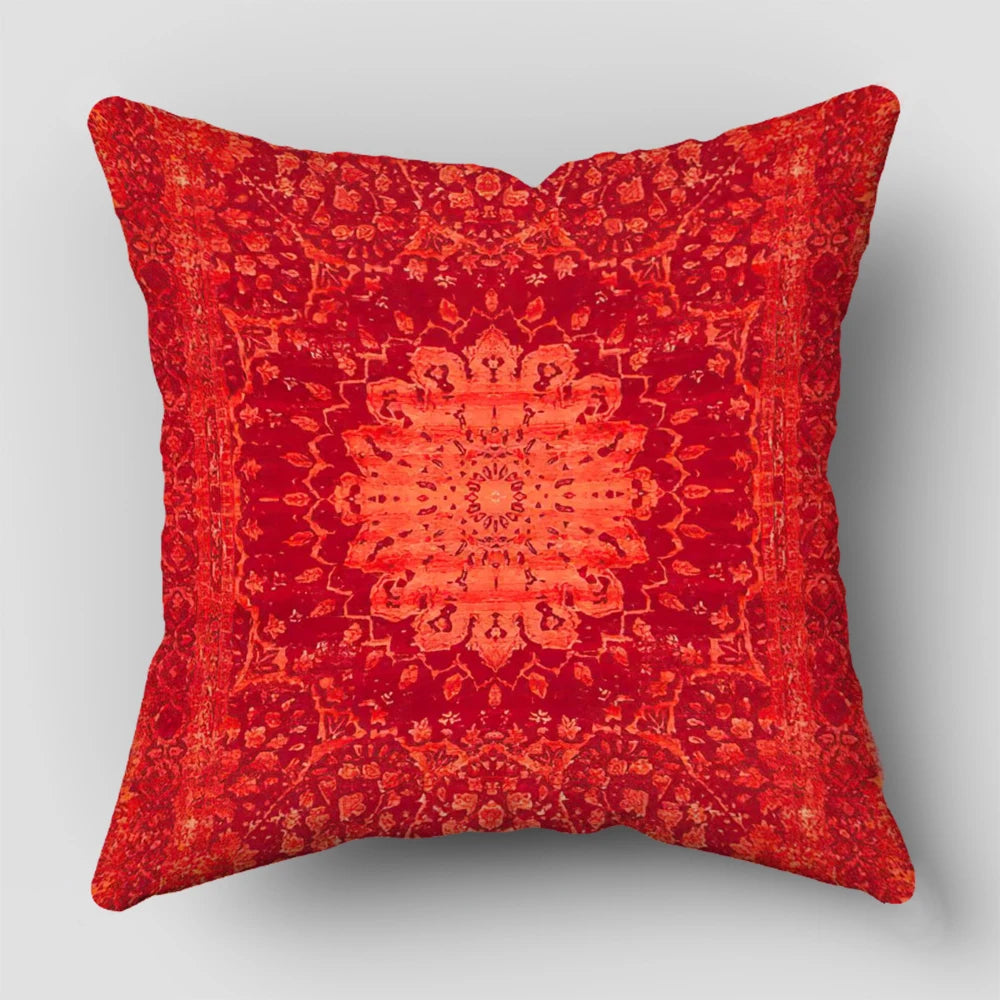 A square decorative cushion cover in a rich, textured red with an intricate Persian pattern.