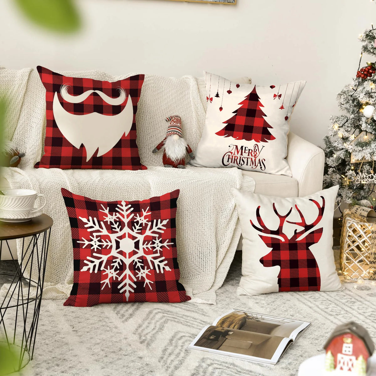A set of festive pillows featuring holiday designs including a mustache, Christmas tree, and deer silhouette on red and white